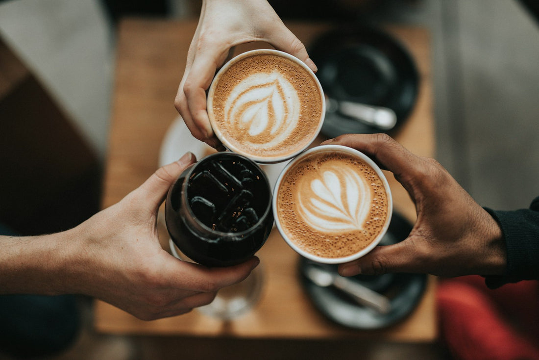 A warm ceramic coffee cup with latte art resting on a rustic wooden table, evoking a peaceful morning ritual