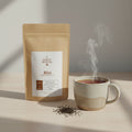 Kraft paper tea bag with a label on a white background